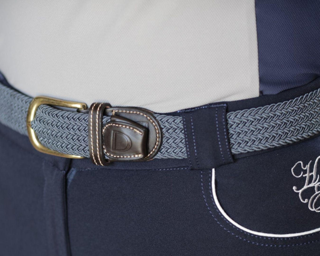  Huntington Braided Equestrian Belt, made from nylon stretch braid and features a brass buckle. It is 3cm wide and designed to be adjustable for a personalized fit. The braided design adds texture and visual interest to the belt