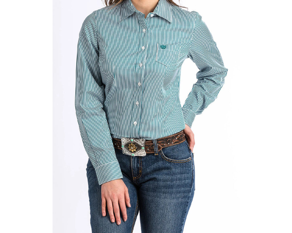 CINCH women’s shirts are designed to provide classic and timeless fashion for women in and out of the arena. CINCH women’s shirts have extra-long tails so they stay tucked in and longer sleeves for added range of motion while riding or roping. Our women’s shirts come in a variety of solids, stripes, prints and plaids and are offered in many vibrant colours.