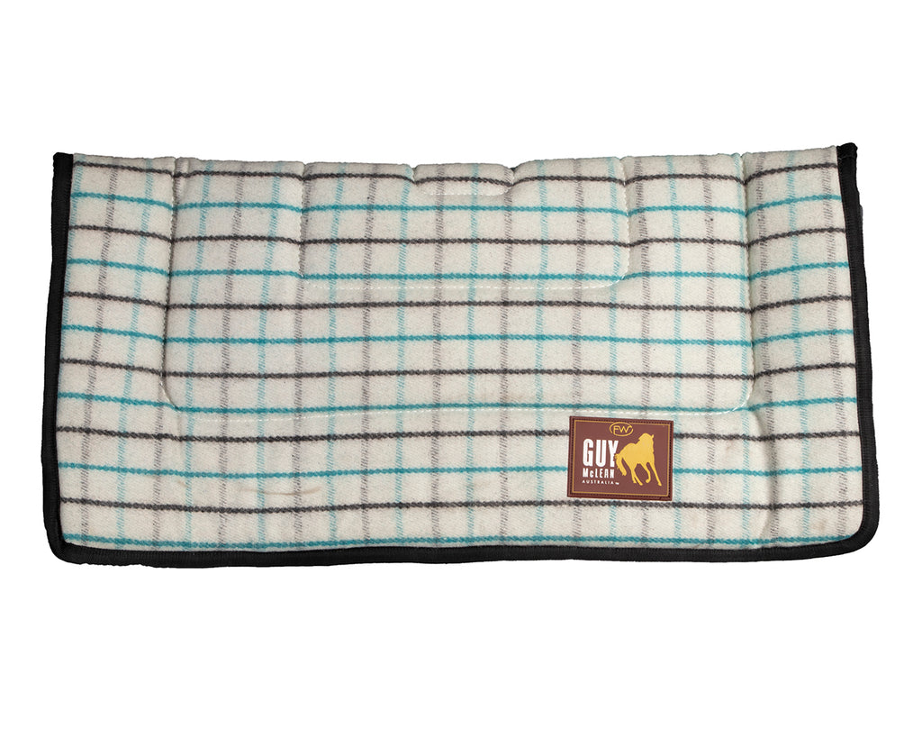Fort Worth Guy McLean Wool Saddle Pad, featuring a natural wool outer layer. The pad measures 31" x 31" and is designed to keep horses cool and comfortable during long rides. The neutral-colored pad showcases a simple, elegant design.