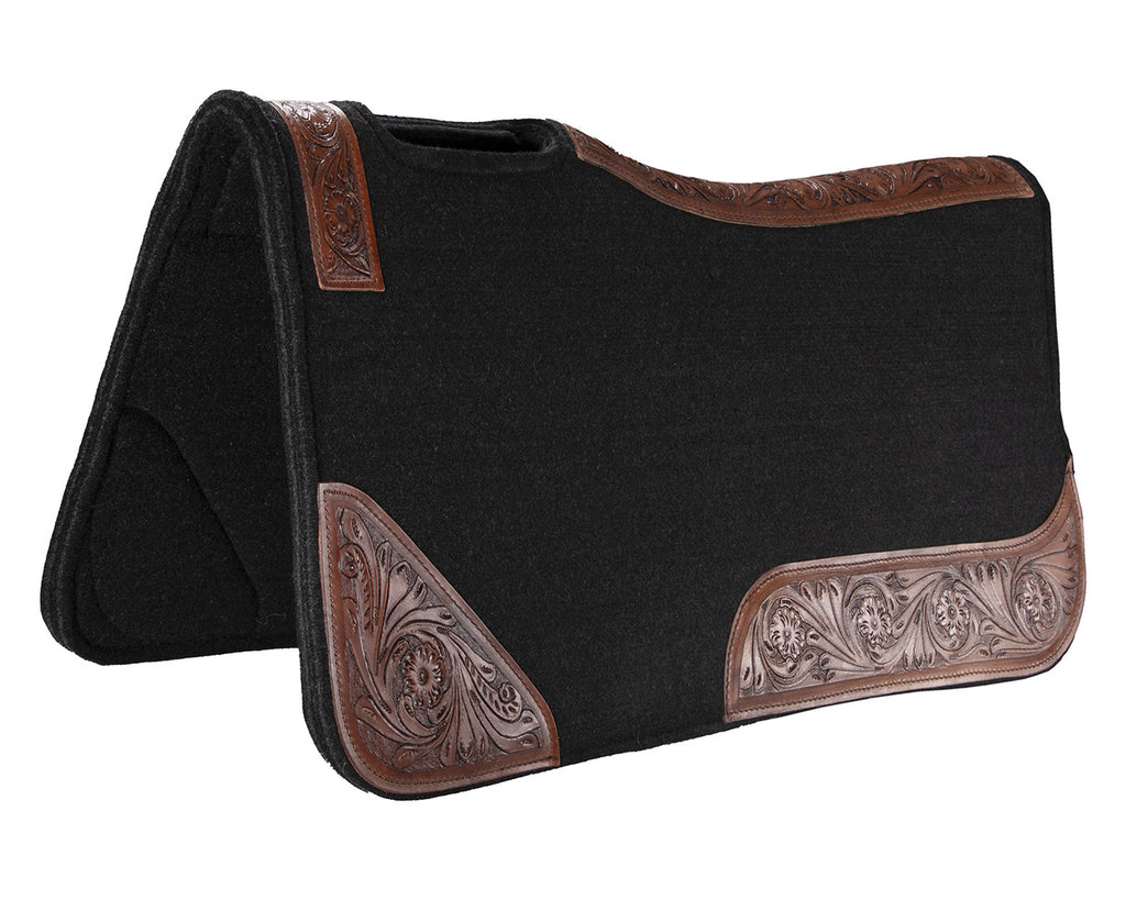 felt and leather saddle pad with contoured spine and wither relief. 20mm thick, one-piece felt construction reduces slipping. Shock absorption and tooled floral pattern wear leathers. Size: 32” x 30”.