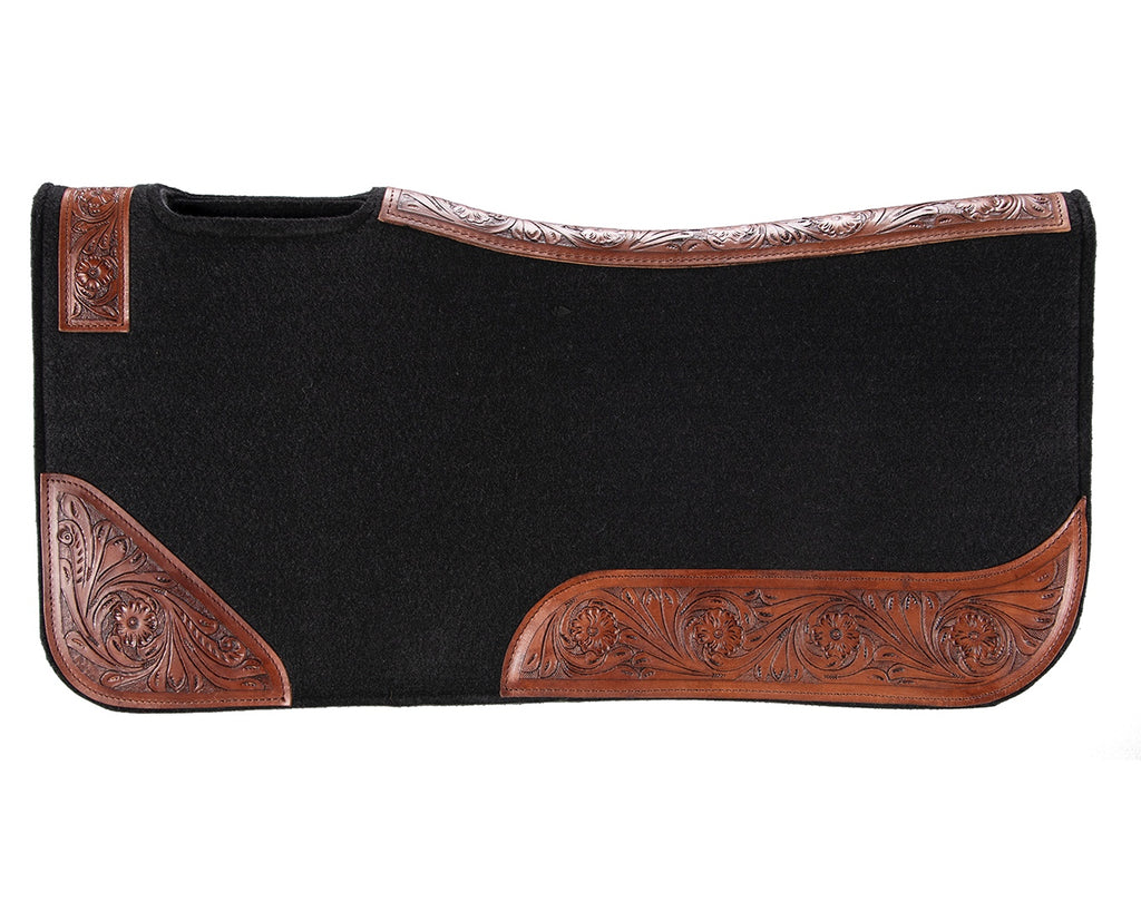 felt and leather saddle pad with contoured spine and wither relief. 20mm thick, one-piece felt construction reduces slipping. Shock absorption and tooled floral pattern wear leathers. Size: 32” x 30”.