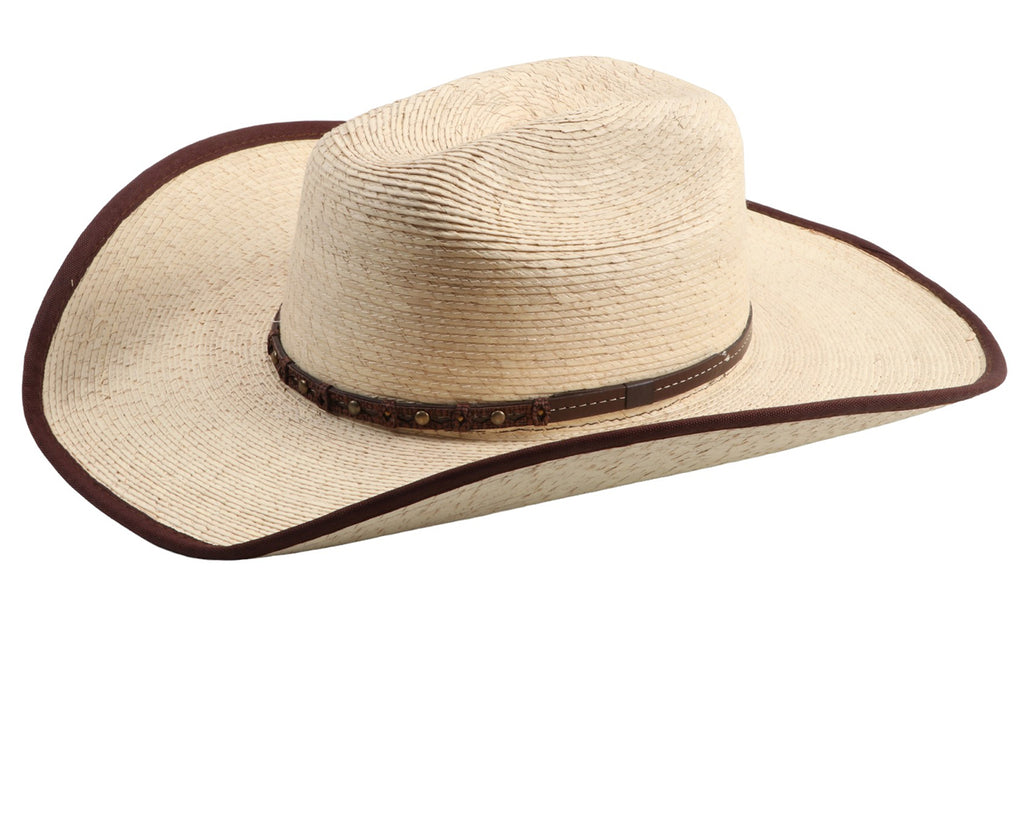 Gone Country Hats - Ponderosa Palm Leaf Hat: A close-up image of a white palm leaf cowboy hat with a brown bound edge. The hat has a 4-1/2 inch crown and a wired, shapeable brim measuring 4 inches. It features a flex sweatband and is suitable for working or playing outside. The hat is handmade, so measurements may vary slightly. Available at Greg Grant Saddlery.