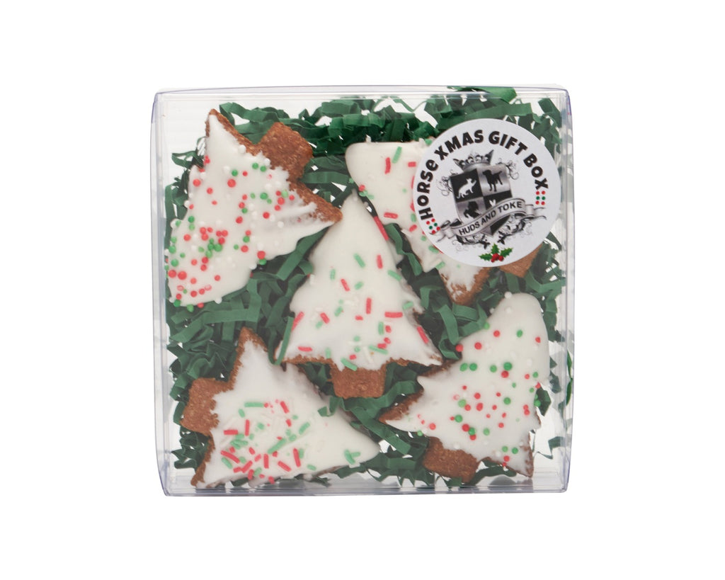 Celebrate the holiday season with the Huds & Toke Pony Xmas Tree Gift Box, featuring cute Christmas tree-shaped gourmet pony treats perfect for gifting to your pony or rider friends, containing 5 delicious molasses biscuits with sugary icing and festive sprinkles for a delightful and crunchy treat for all ages of horses and ponies.