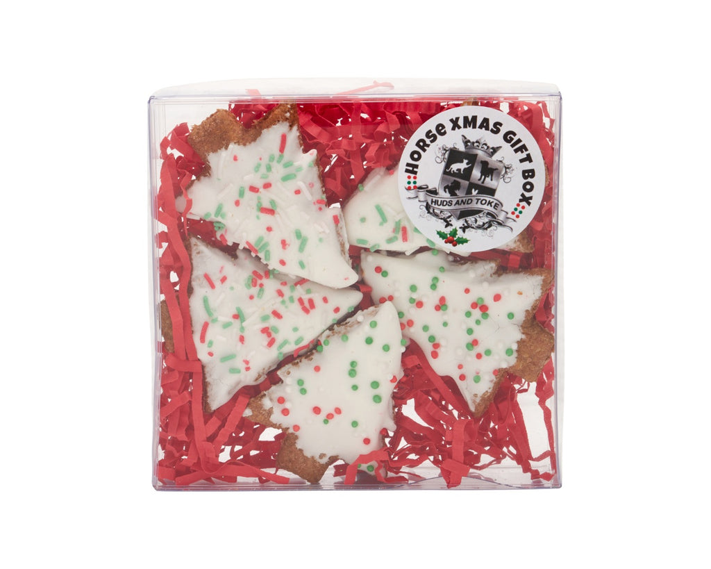 Celebrate the holiday season with the Huds & Toke Pony Xmas Tree Gift Box, featuring cute Christmas tree-shaped gourmet pony treats perfect for gifting to your pony or rider friends, containing 5 delicious molasses biscuits with sugary icing and festive sprinkles for a delightful and crunchy treat for all ages of horses and ponies.