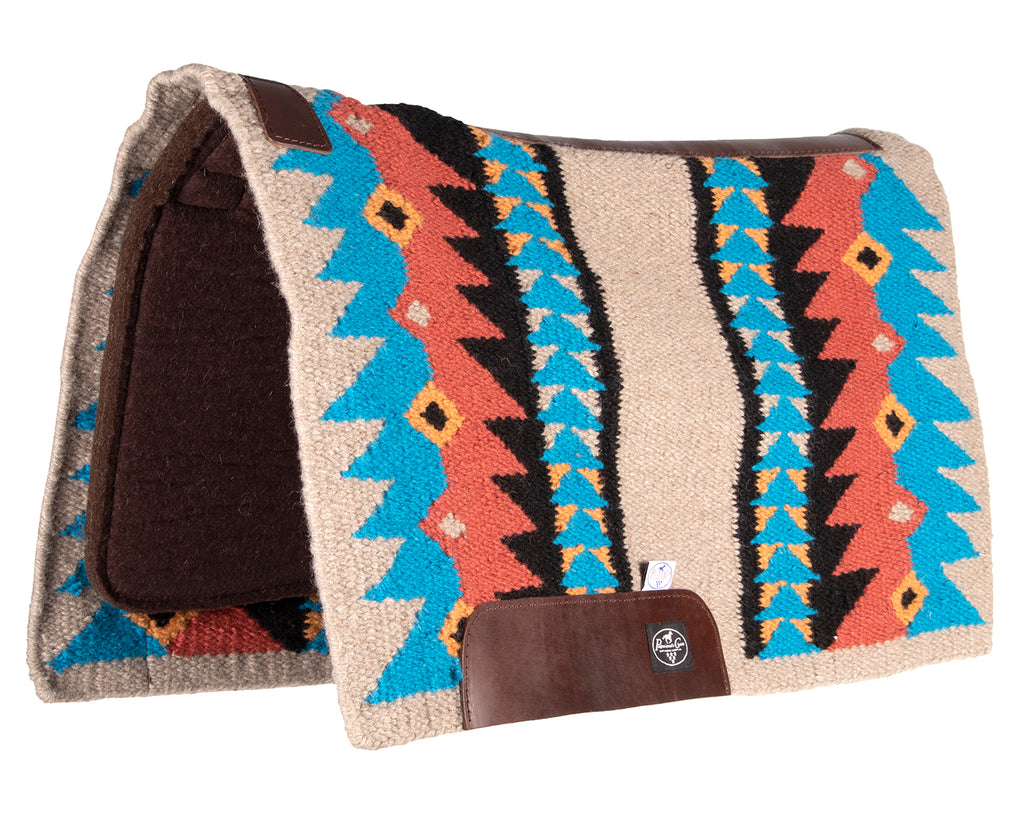 professionals choice fusion saddle pad is a combination of a hand-woven New Zealand wool blanket top and a 100% steam pressed wool felt pad, providing superior cushioning and impact protection