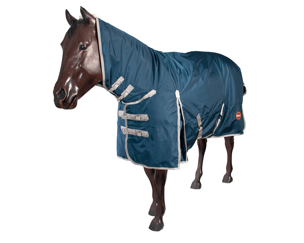 The Kozy 1680D Horse Rug Combo With Teflon Coat offers superior protection and durability. It features a 1680 denier seamless ripstop outer, waterproof and breathable fabric, 250g polyfill, and quilted satin lining. The Teflon® coating repels dirt and water, making it easy to clean. Includes double chest straps, removable leg straps, crossover surcingles, and shoulder gusset. Available at Greg Grant Saddlery for ultimate horse protection.