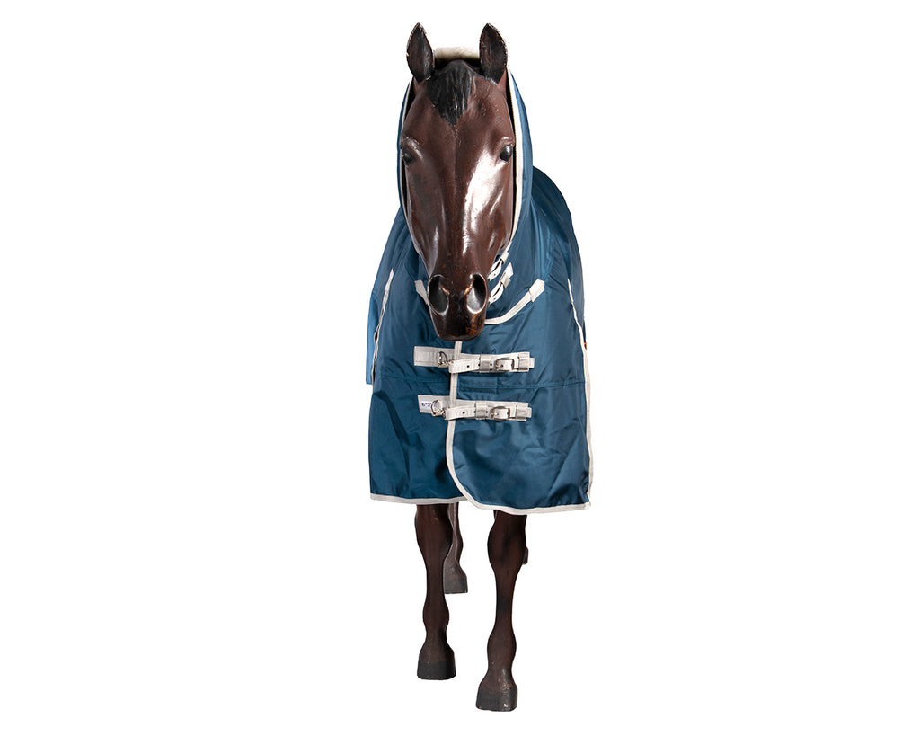 The Kozy 1680D Horse Rug Combo With Teflon Coat offers superior protection and durability. It features a 1680 denier seamless ripstop outer, waterproof and breathable fabric, 250g polyfill, and quilted satin lining. The Teflon® coating repels dirt and water, making it easy to clean. Includes double chest straps, removable leg straps, crossover surcingles, and shoulder gusset. Available at Greg Grant Saddlery for ultimate horse protection.