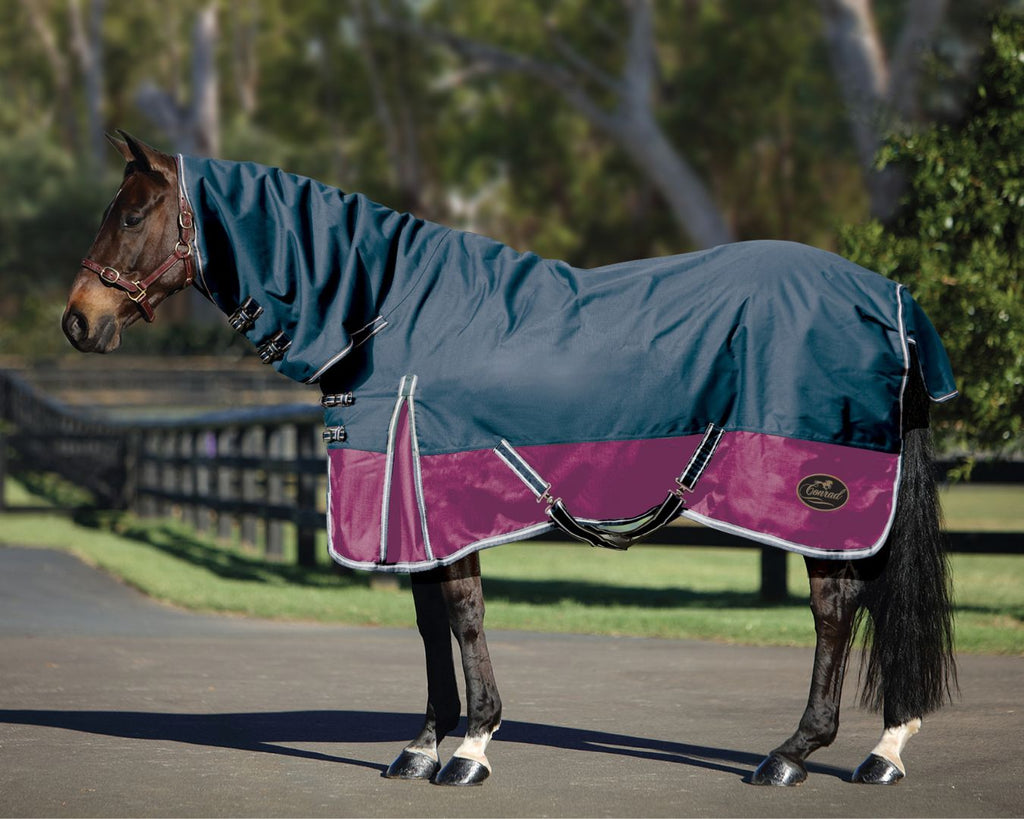 image of a Conrad Horse Rug Combo, showcasing its features. The combo is made from a strong 1200 Denier ripstop material, with satin lining and 250 grams polyfill for warmth and protection during winter. It features a seamless back, waterproof construction, shoulder gusset, double crossover belly surcingles, removable leg straps with metal fittings, 250g polyfill, double chest straps, a large tail flap, and double buckle-up straps on the neck rug.