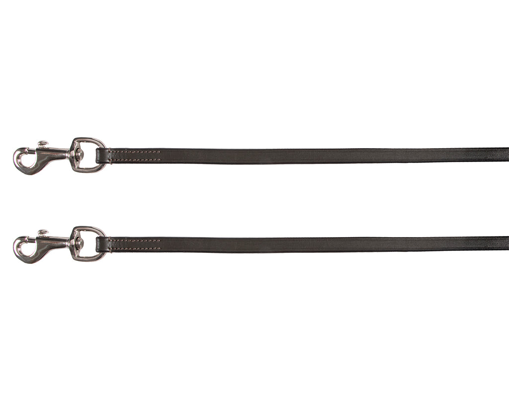 A pair of brown leather draw reins from Jeremy & Lord, with one long strip on each side. They are attached to the bit rings and girth of a horse, with a hand holding one end. The reins are used as a training aid to encourage the horse to work from its hindquarters, drop its head, and maintain a proper position of its head and neck. The reins measure 1/2" wide and 102" long on each side.