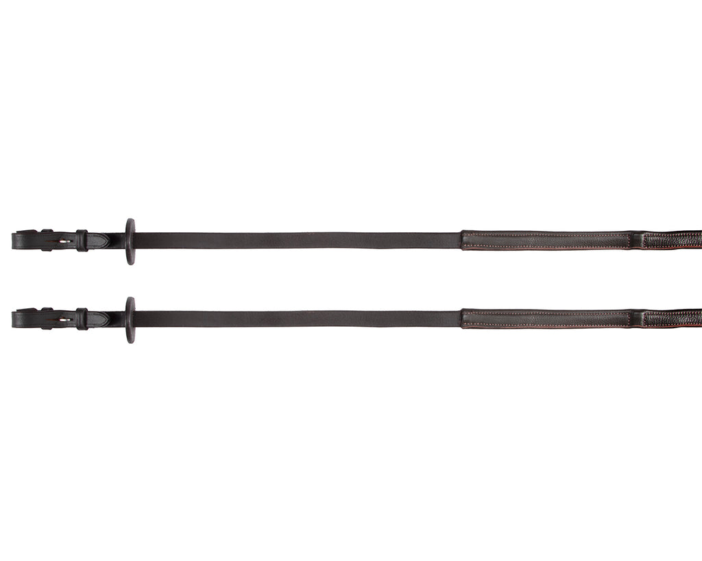 A pair of brown leather reins from Jeremy & Lord with leather-covered stops. The reins are made of soft nappa leather and have a smooth finish. They are being held by a hand, with the grip stops visible. These reins are useful for training and maintaining an even rein length while riding.