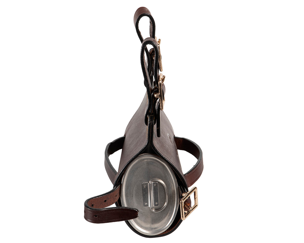  Oval Bushman's Quart Pot Holder - Designed for holding an oval bushman's quart pot (not included). Features solid brass buckles and made with sturdy leather. Two adjustable straps for attaching to saddle, bike, boat, etc. Straps measure 10.5cm when fastened on the last (longest) hole. Adjustable strap for securing the quart pot. Measures 17.5cm length x 19cm deep.